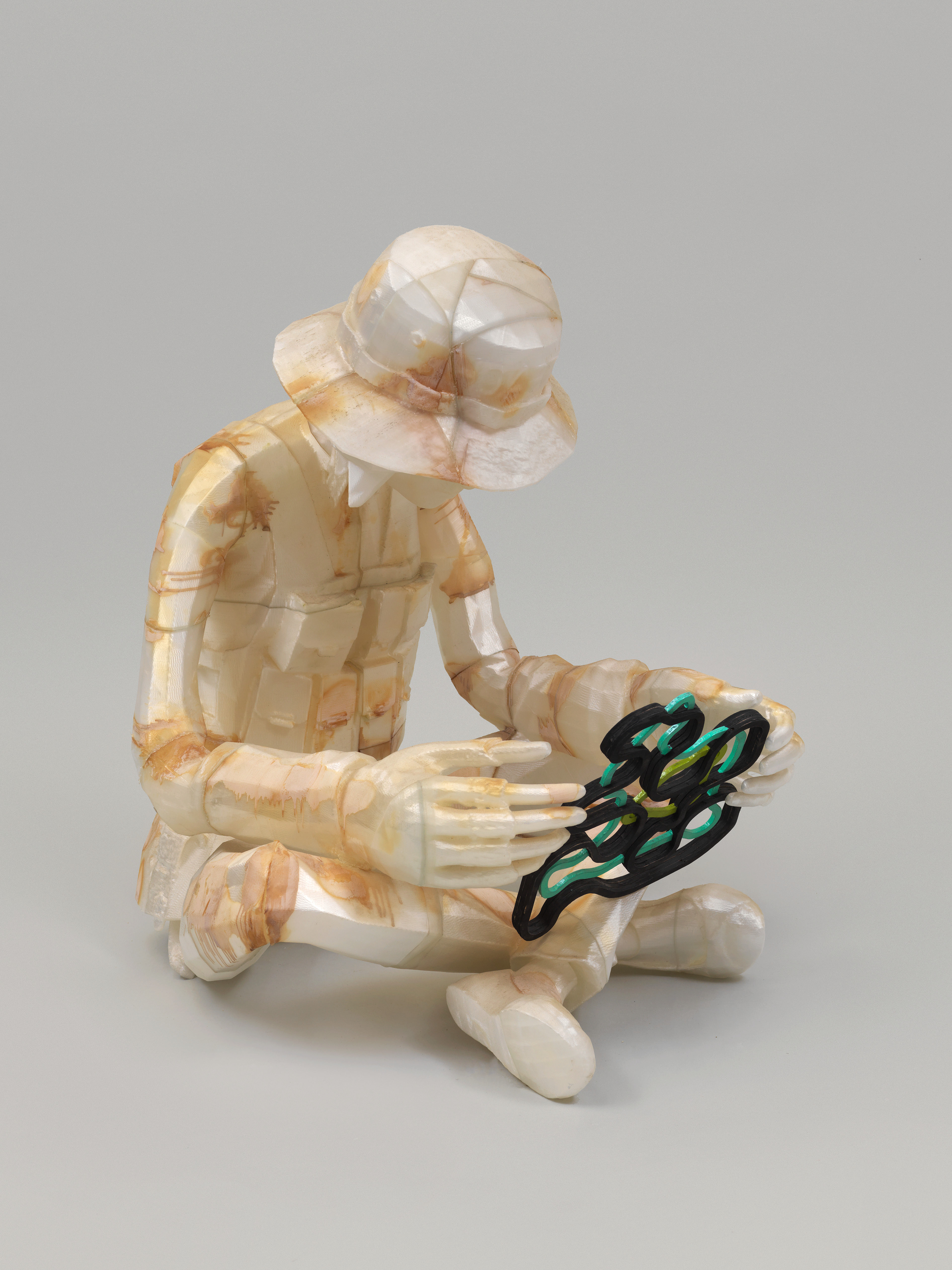 Child Soldier Examining Fun Shape — image 2 of 3
